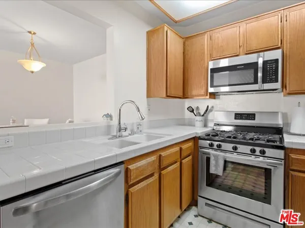 a kitchen with a stove and a microwave