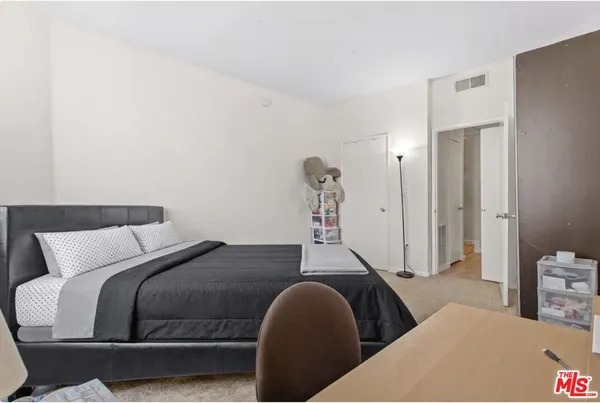 a bedroom with a bed and closet