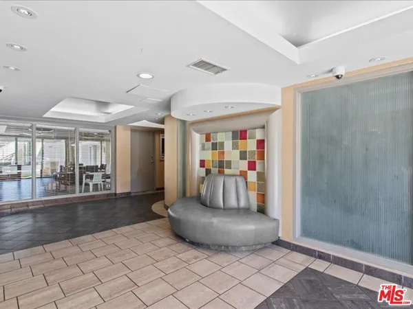 a bathroom with a shower and a sink