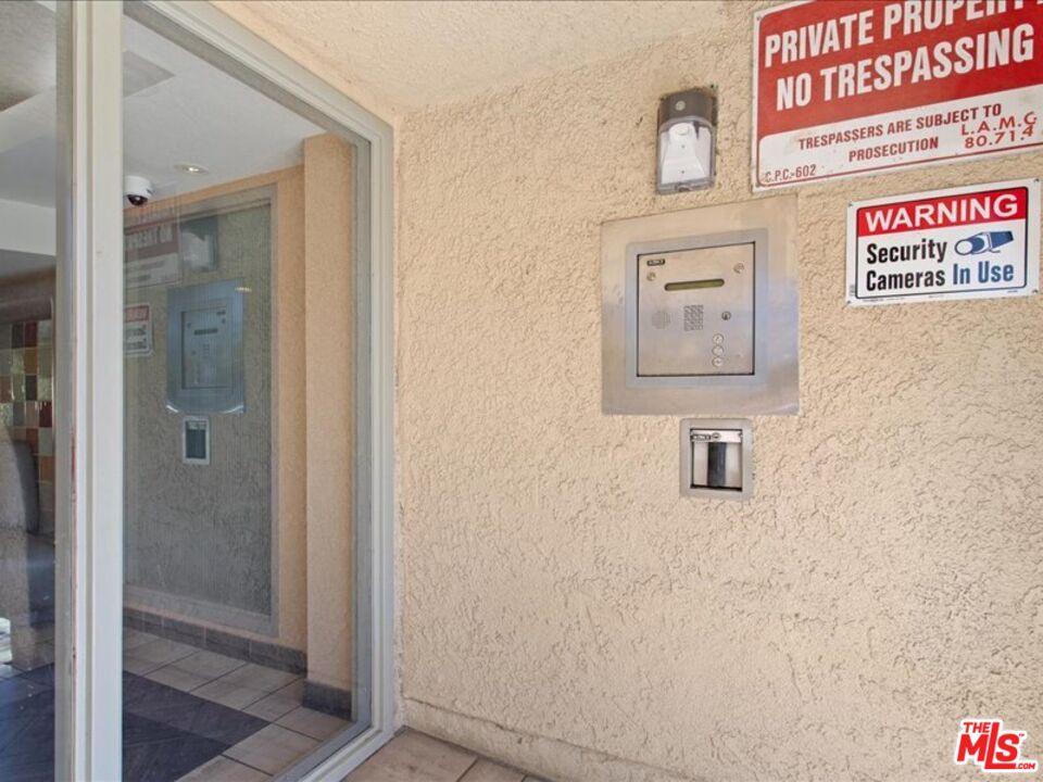 19009 Sherman Way, Unit 2 Reseda, CA 91335 - Photo 25 of 31 a bathroom with a shower and a sink