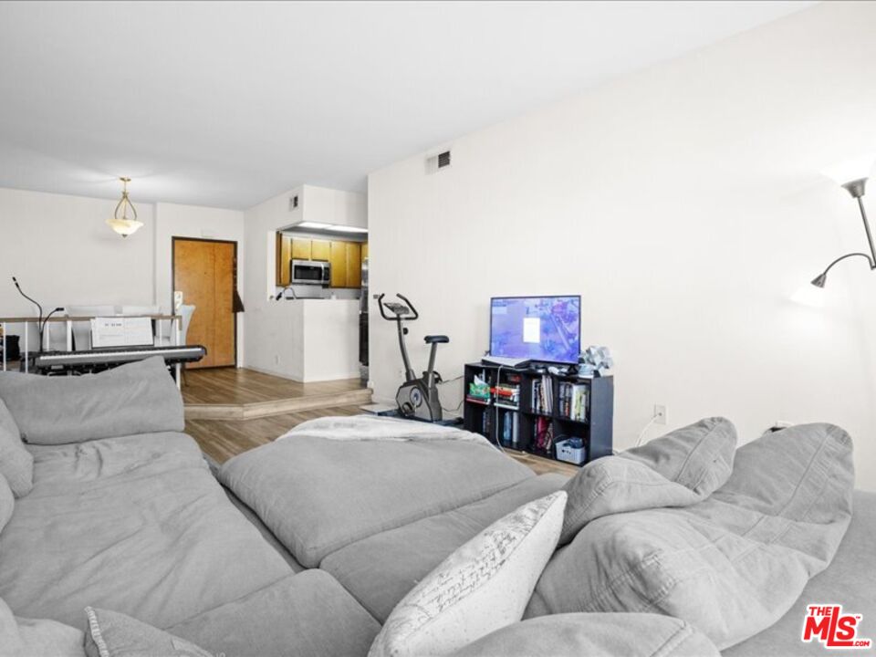 19009 Sherman Way, Unit 2 Reseda, CA 91335 - Photo 6 of 31 a living room with furniture and a couch