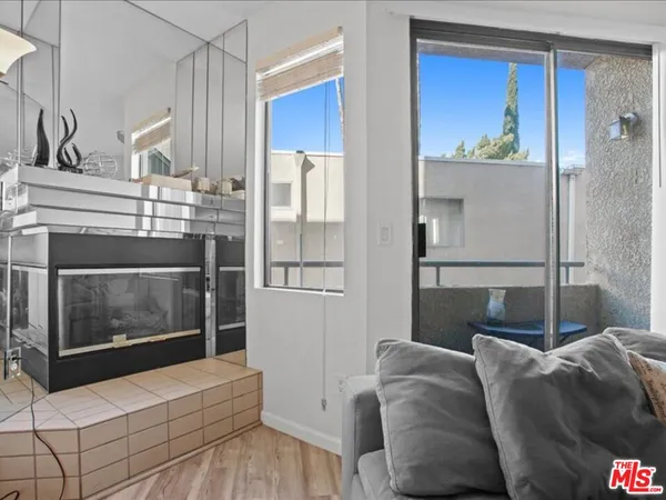 a living room with a couch and a fireplace