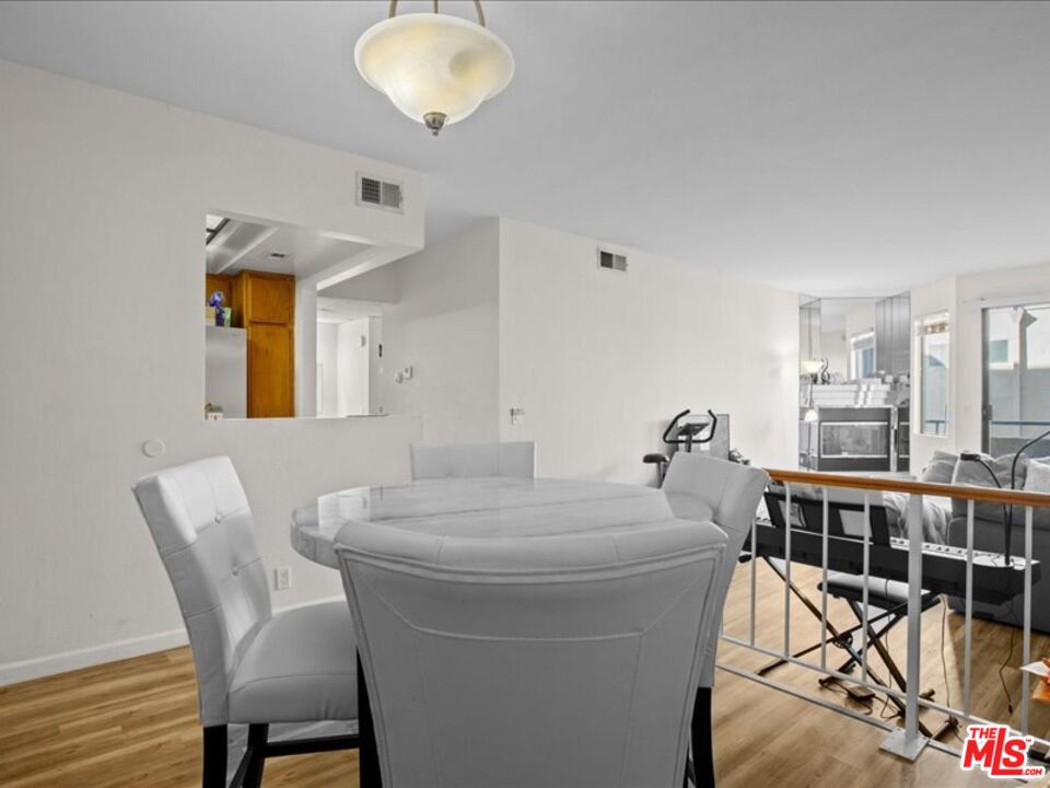 19009 Sherman Way, Unit 2 Reseda, CA 91335 - Photo 8 of 31 a dining room with furniture and window