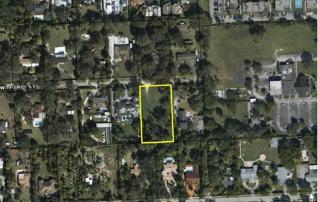 an aerial view of a residential houses with outdoor space