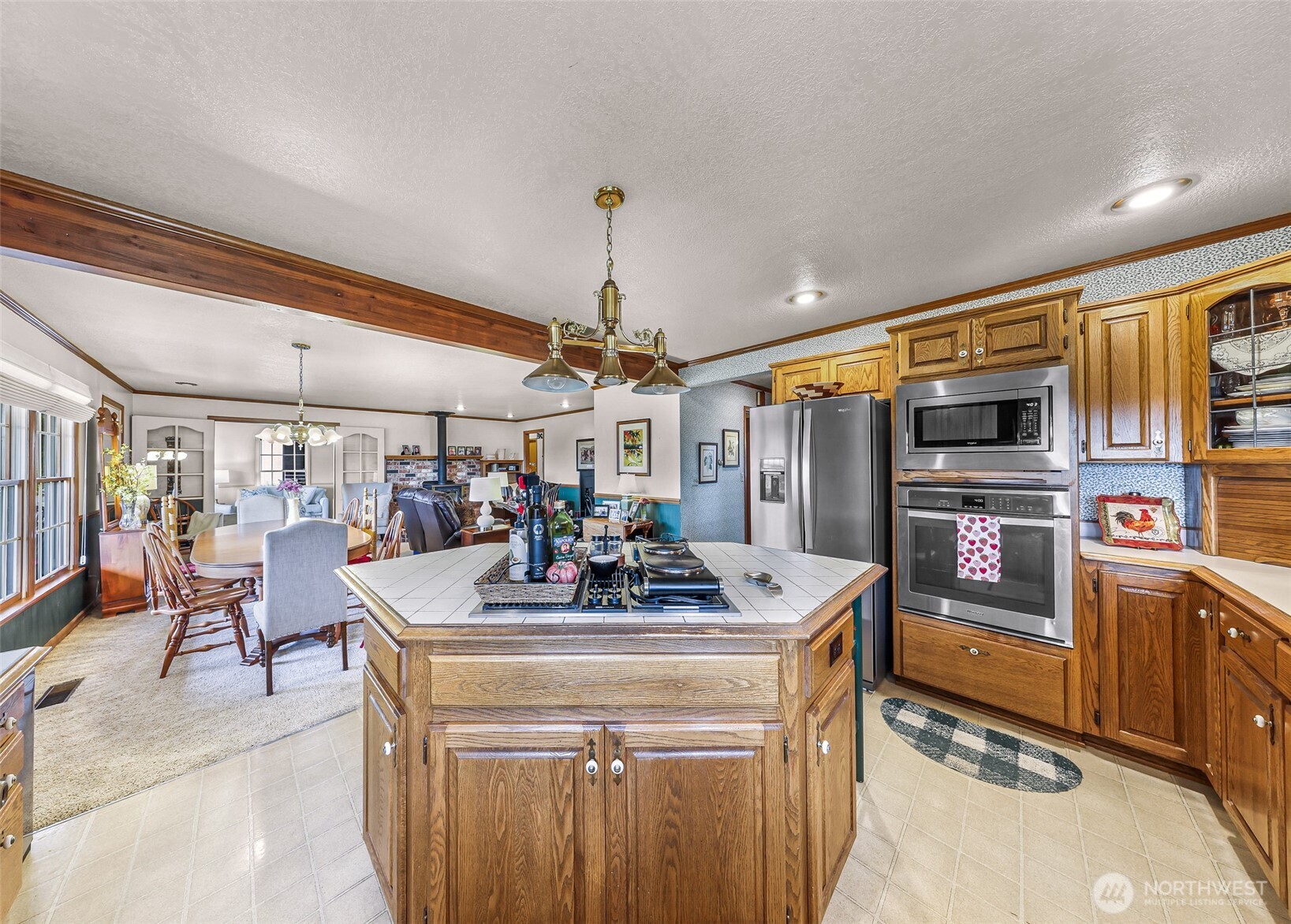 8634 Double Ditch Road Lynden, WA 98264 - Photo 6 of 40 a kitchen with stainless steel appliances granite countertop a sink and a refrigerator