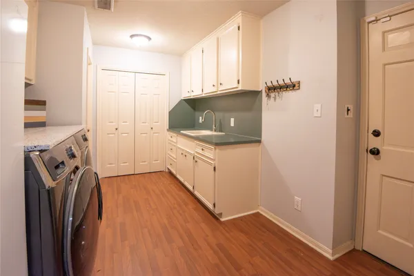 a kitchen with stainless steel appliances a refrigerator and a stove