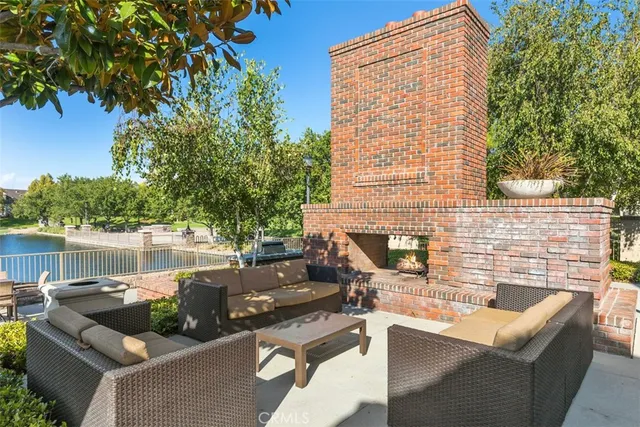swimming pool with outdoor seating and plants