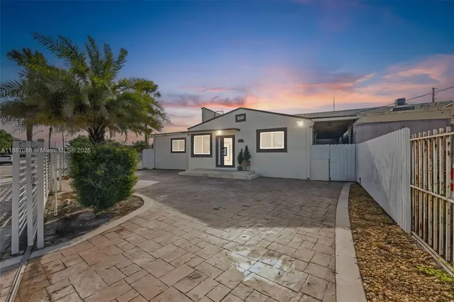 a view of a house with a yard