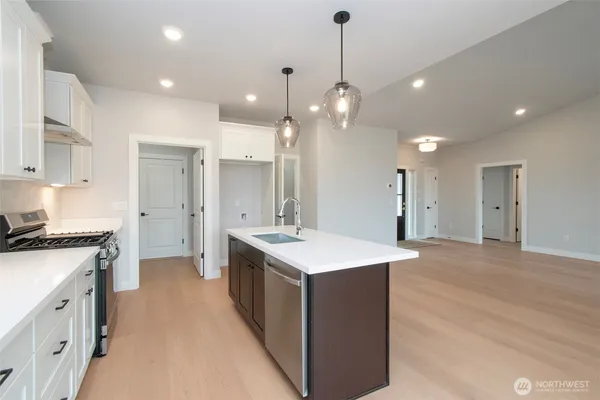 a bathroom with a toilet a sink and tub
