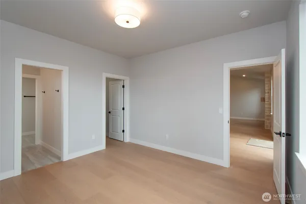 an empty room with windows and city view