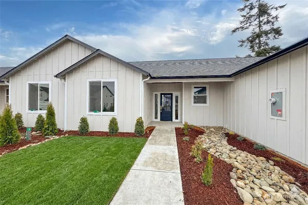 a front view of a house with a yard