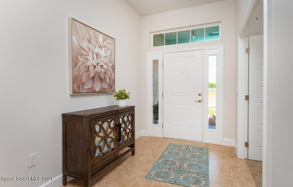 991 Tupelo Circle Cocoa, FL 32926 - Photo 2 of 23 a view of an entryway with a rug