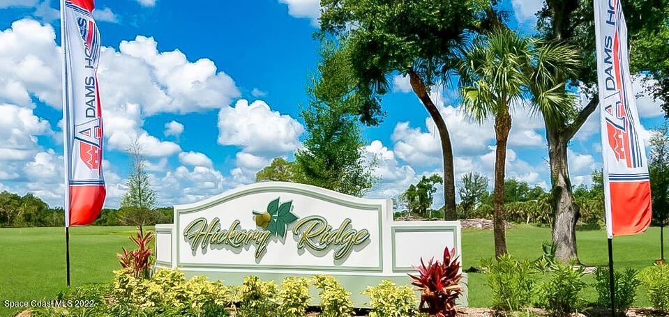 991 Tupelo Circle Cocoa, FL 32926 - Photo 22 of 23 a sign on the side of a road