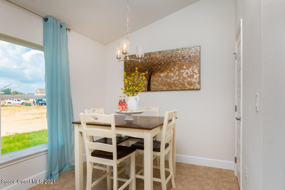 991 Tupelo Circle Cocoa, FL 32926 - Photo 8 of 23 a view of a dining room with furniture and window