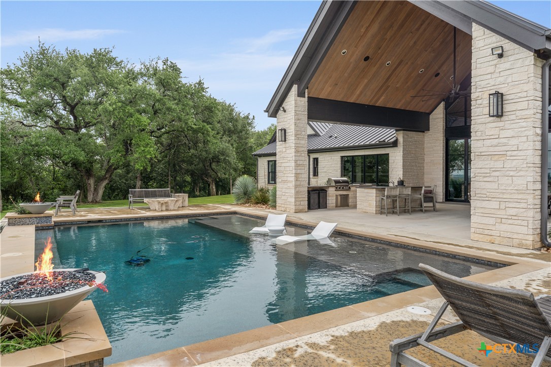 19102 Post Oak Road Bartlett, TX 76511 - Photo 39 of 43 a view of a swimming pool with sitting area