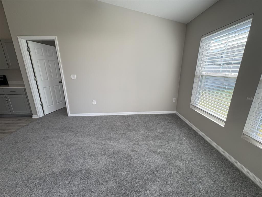 13105 Fruitville Way Riverview, FL 33579 - Photo 17 of 56 a view of empty room with window