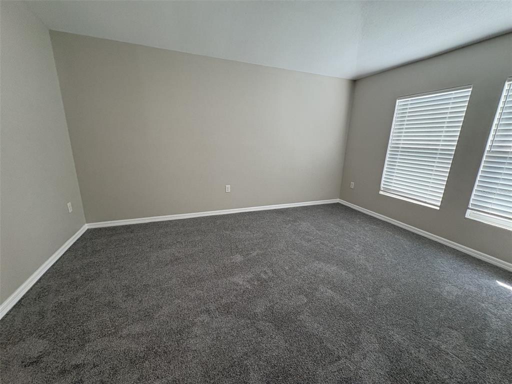 13105 Fruitville Way Riverview, FL 33579 - Photo 18 of 56 a view of an empty room with a window