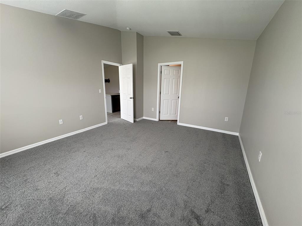 13105 Fruitville Way Riverview, FL 33579 - Photo 19 of 56 a view of an empty room with closet area