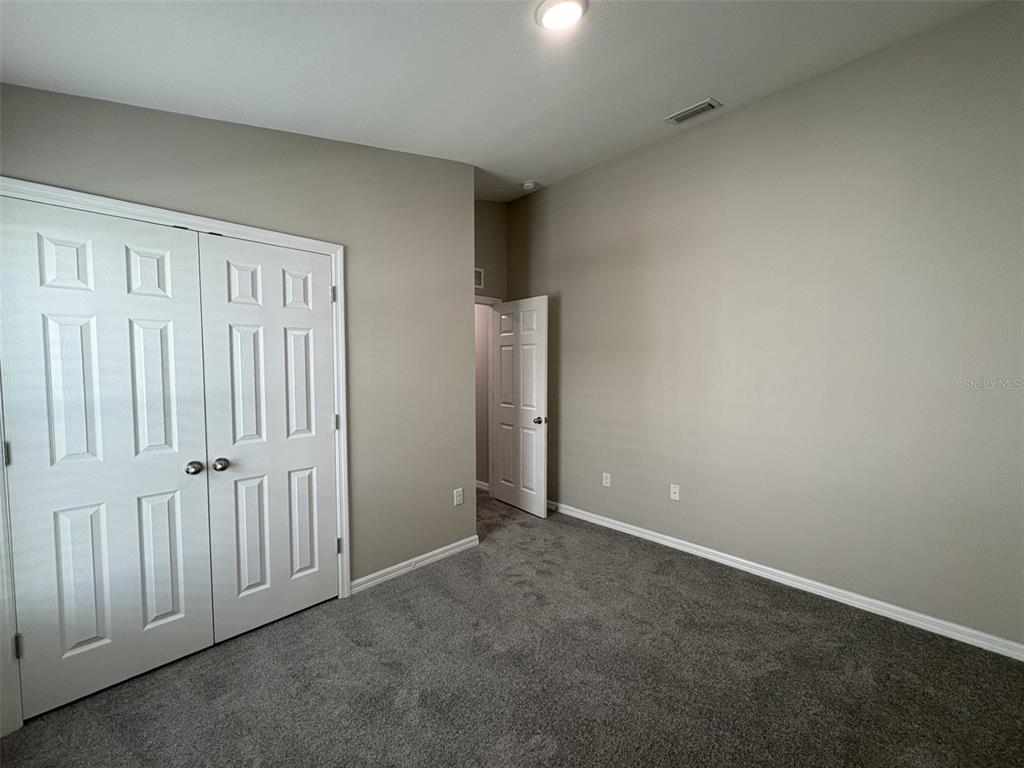 13105 Fruitville Way Riverview, FL 33579 - Photo 21 of 56 an empty room with windows