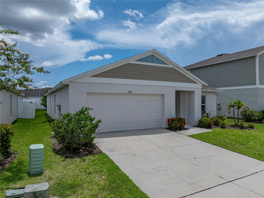 13105 Fruitville Way Riverview, FL 33579 - Photo 25 of 56 a front view of house with a garden