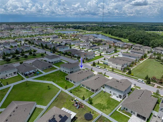 a view of swimming pool with outdoor seating and yard
