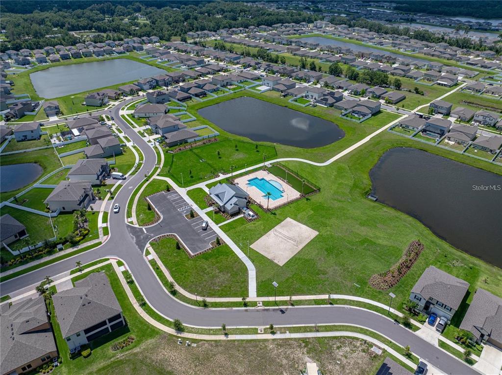 13105 Fruitville Way Riverview, FL 33579 - Photo 55 of 56 an aerial view of a tennis ground and a cars park side
