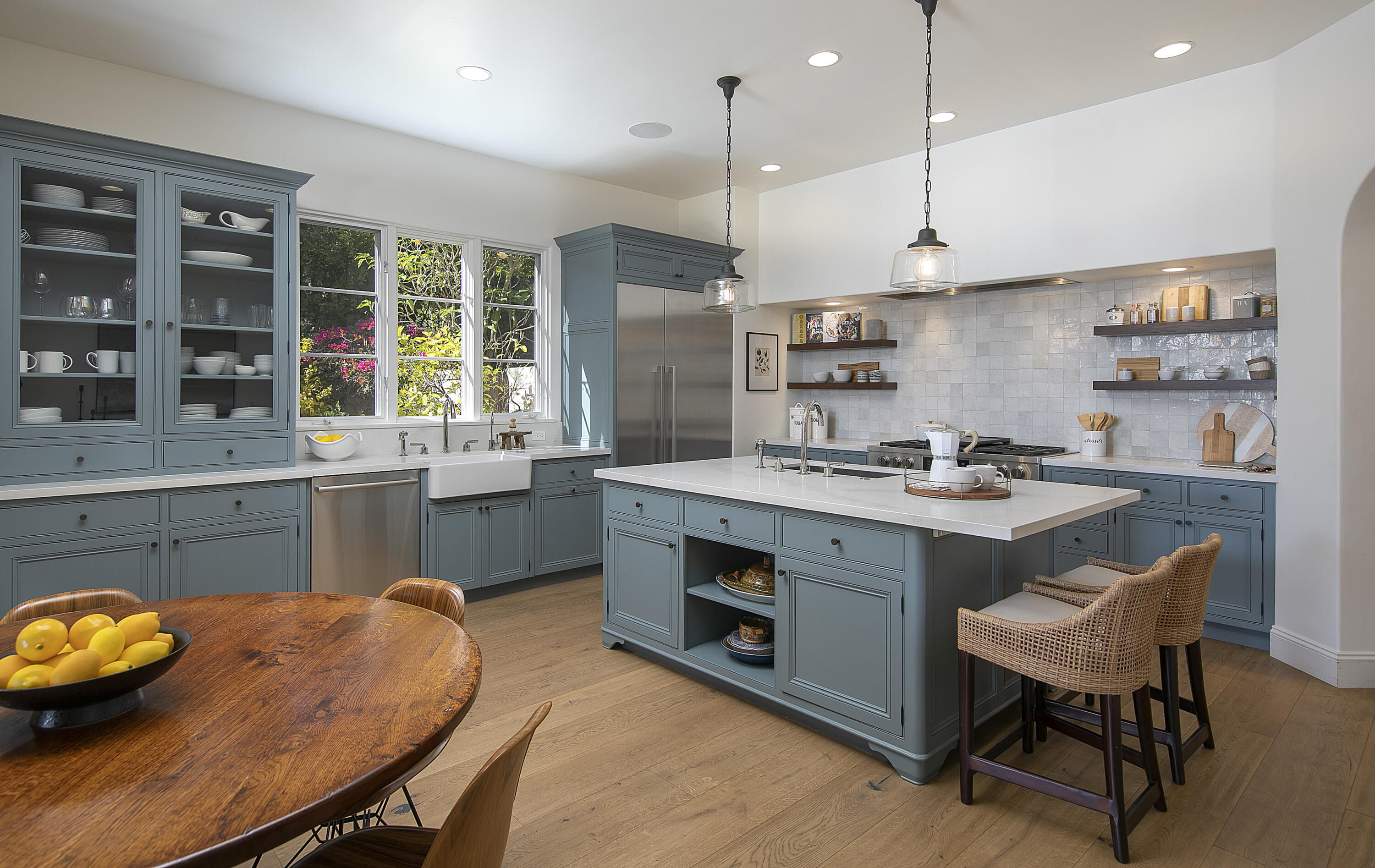 4110 Creciente Drive Santa Barbara, CA 93110 - Photo 14 of 27 a kitchen with a table chairs sink and cabinets