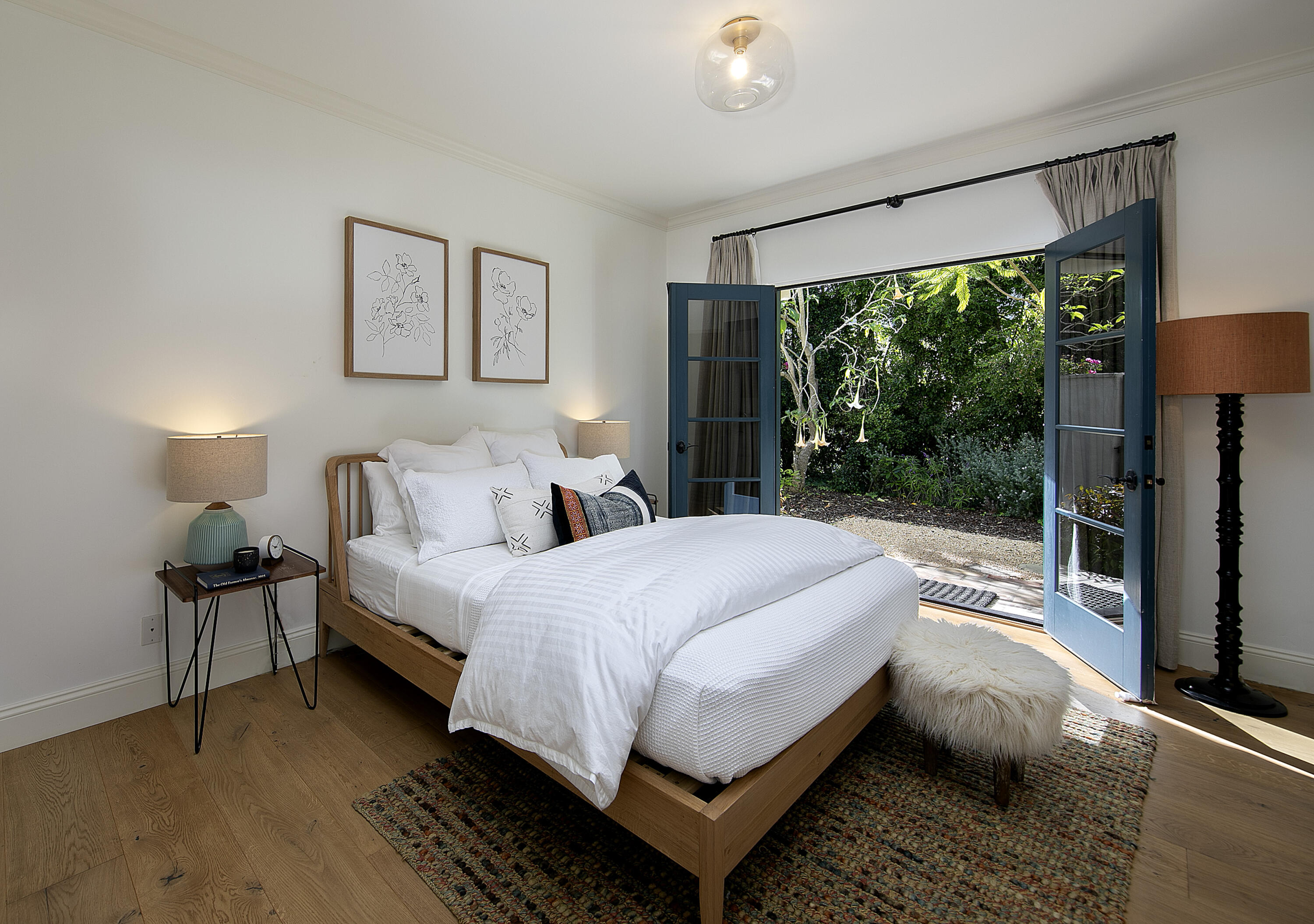 4110 Creciente Drive Santa Barbara, CA 93110 - Photo 21 of 27 a bedroom with a bed and lamp next to a window