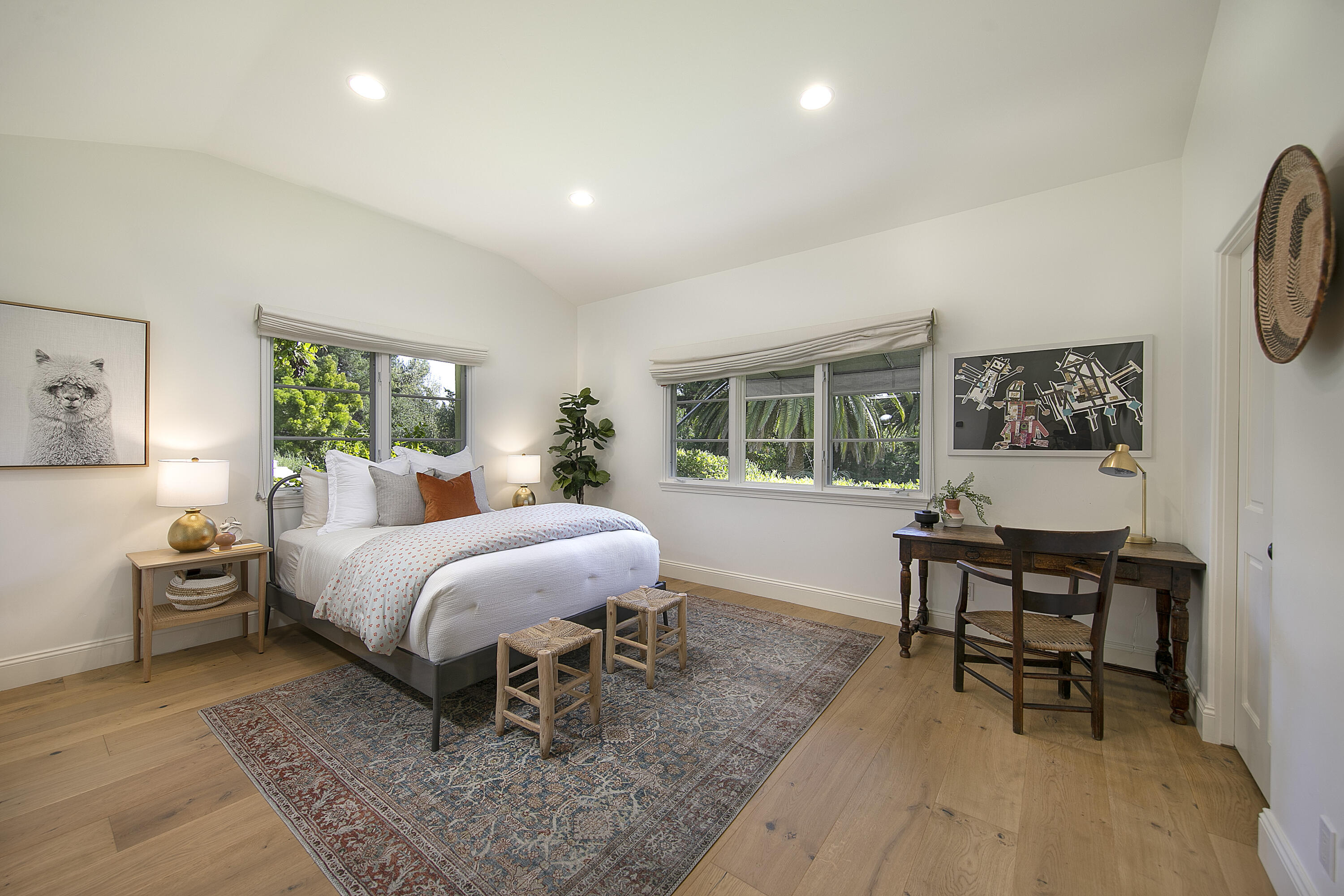 4110 Creciente Drive Santa Barbara, CA 93110 - Photo 22 of 27 a bed room with a bed a table and a large window