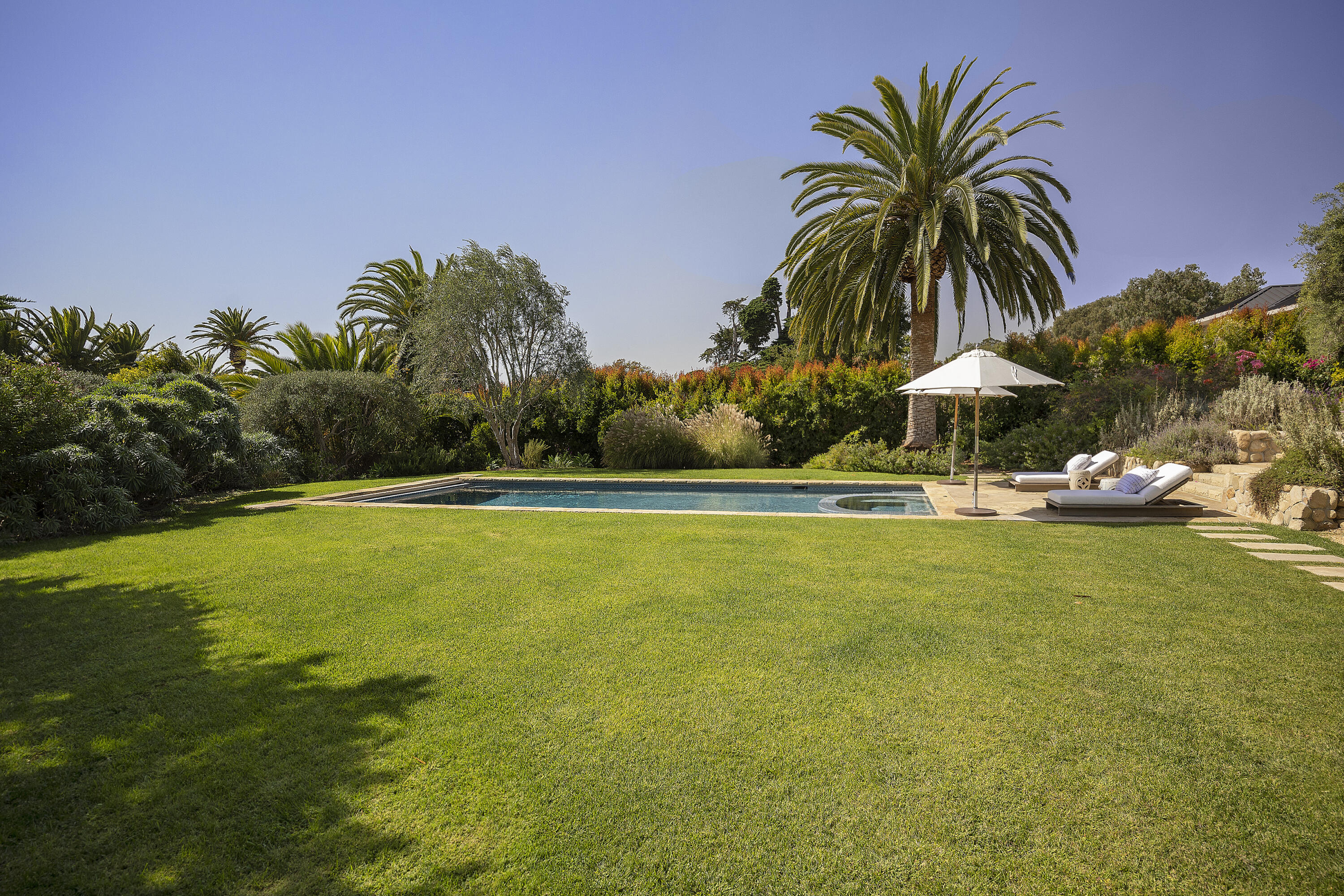 4110 Creciente Drive Santa Barbara, CA 93110 - Photo 25 of 27 a view of a swimming pool with an outdoor space and seating area