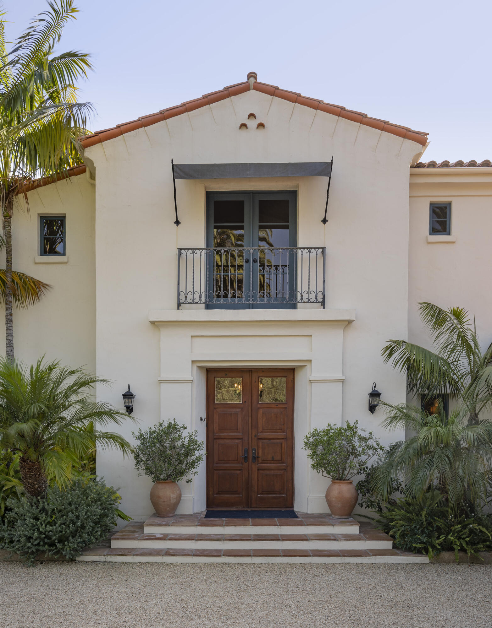 4110 Creciente Drive Santa Barbara, CA 93110 - Photo 6 of 27 a view of a house with potted plants and a large window