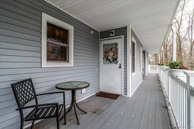 a view of a house with porch and wooden floor