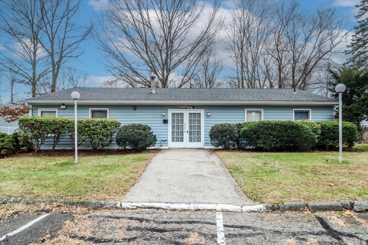 107 Hidden Knolls Circle, Unit 107 Monroe, CT 06468 - Photo 31 of 31 a front view of a house with garden
