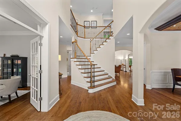 a view of entryway and hall with wooden floor