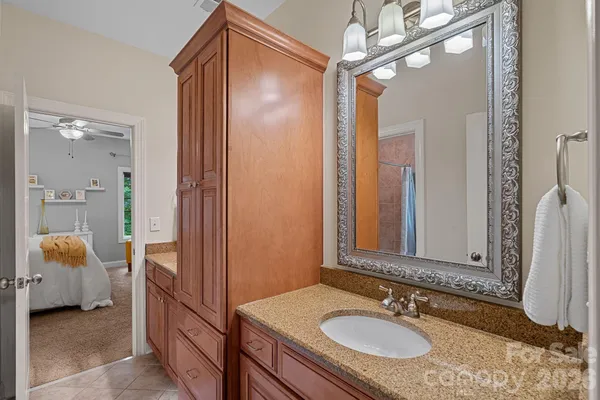 a bathroom with a sink double vanity and a mirror