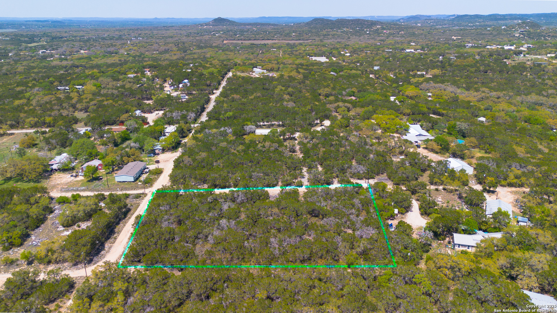 22-nd St Bandera, TX 78003 - Photo 13 of 14 a view of city with lush green forest