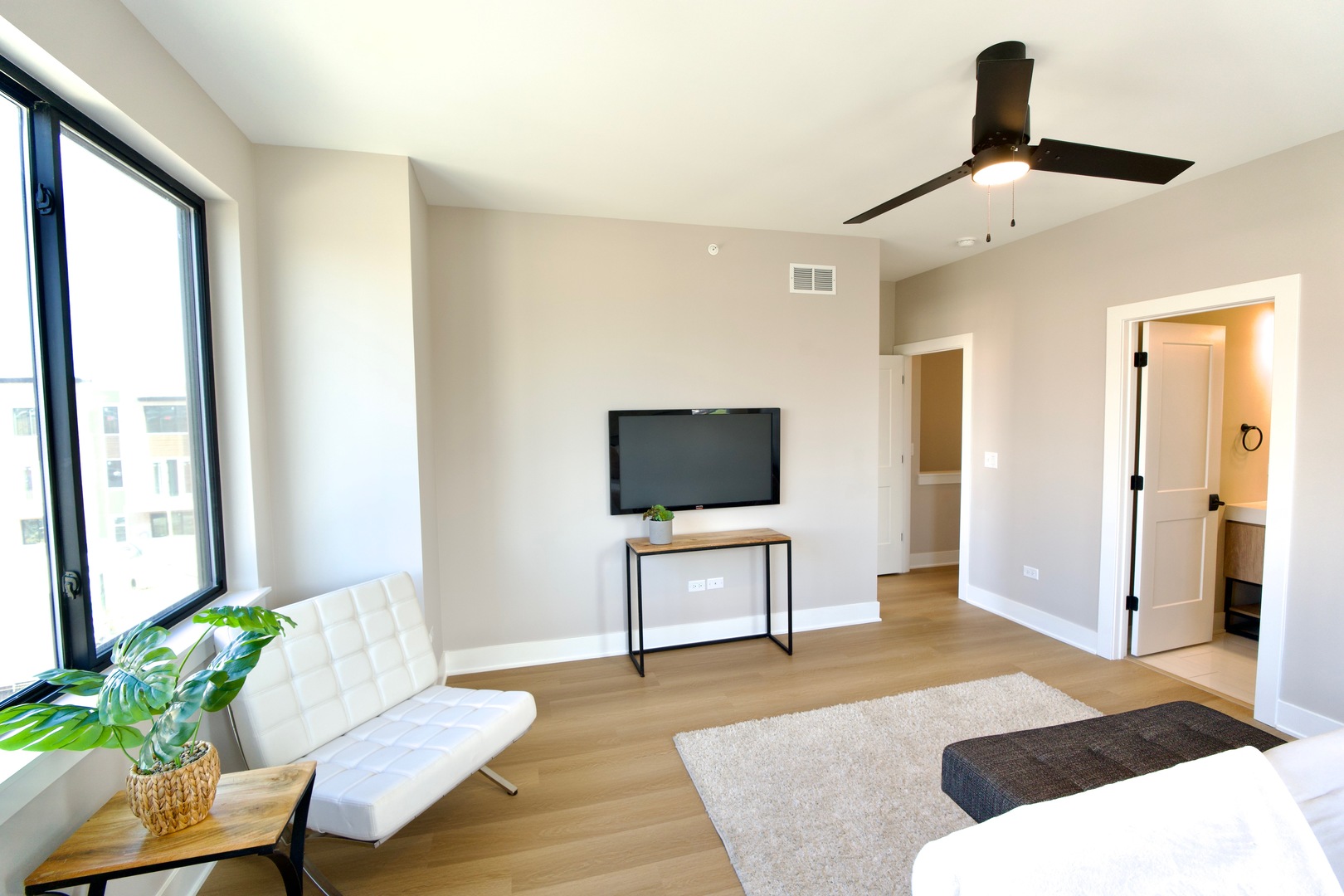 181 Pointe Drive, Unit 181 Northbrook, IL 60062 - Photo 11 of 25 a living room with furniture and a flat screen tv