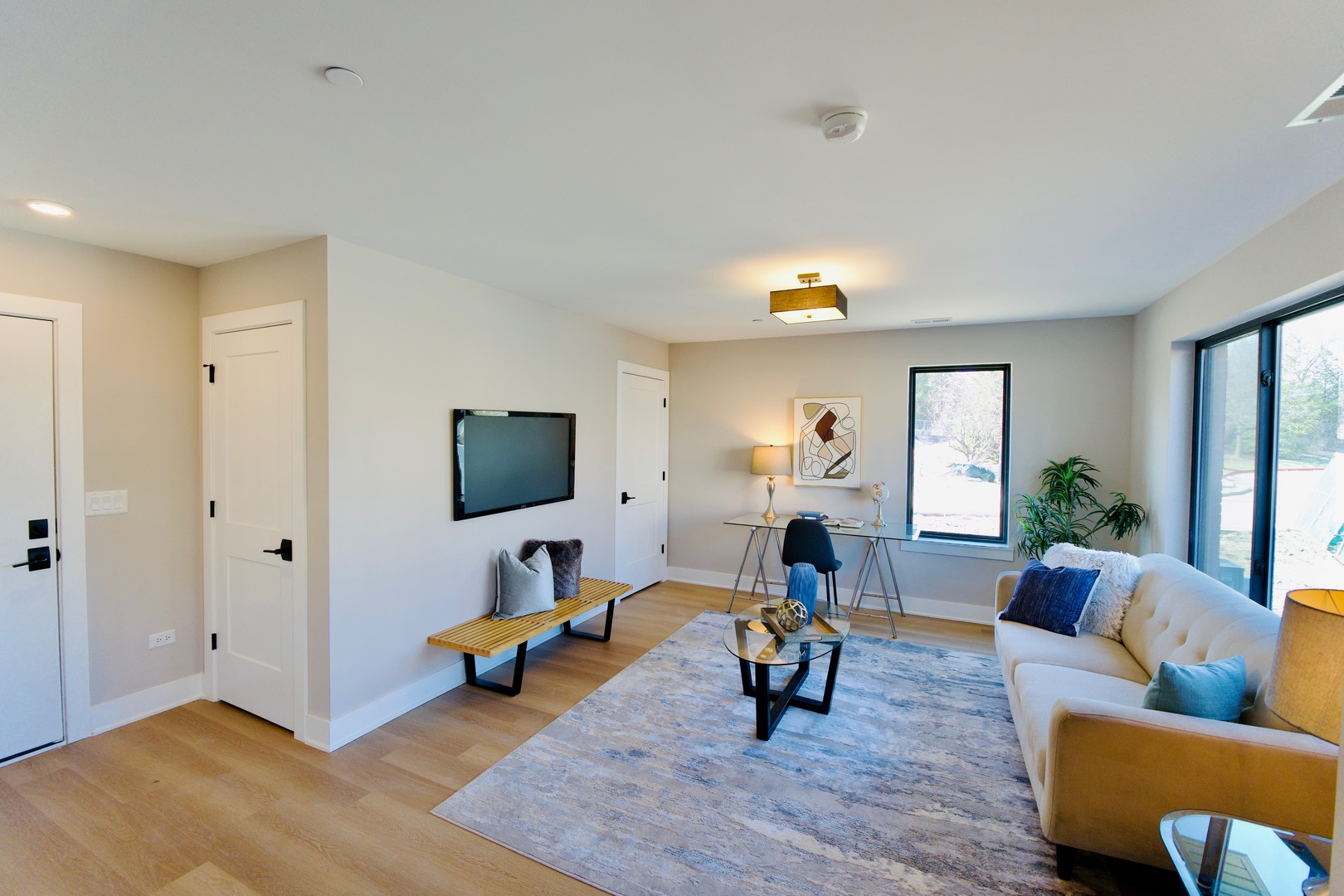 181 Pointe Drive, Unit 181 Northbrook, IL 60062 - Photo 5 of 25 a living room with furniture and a flat screen tv
