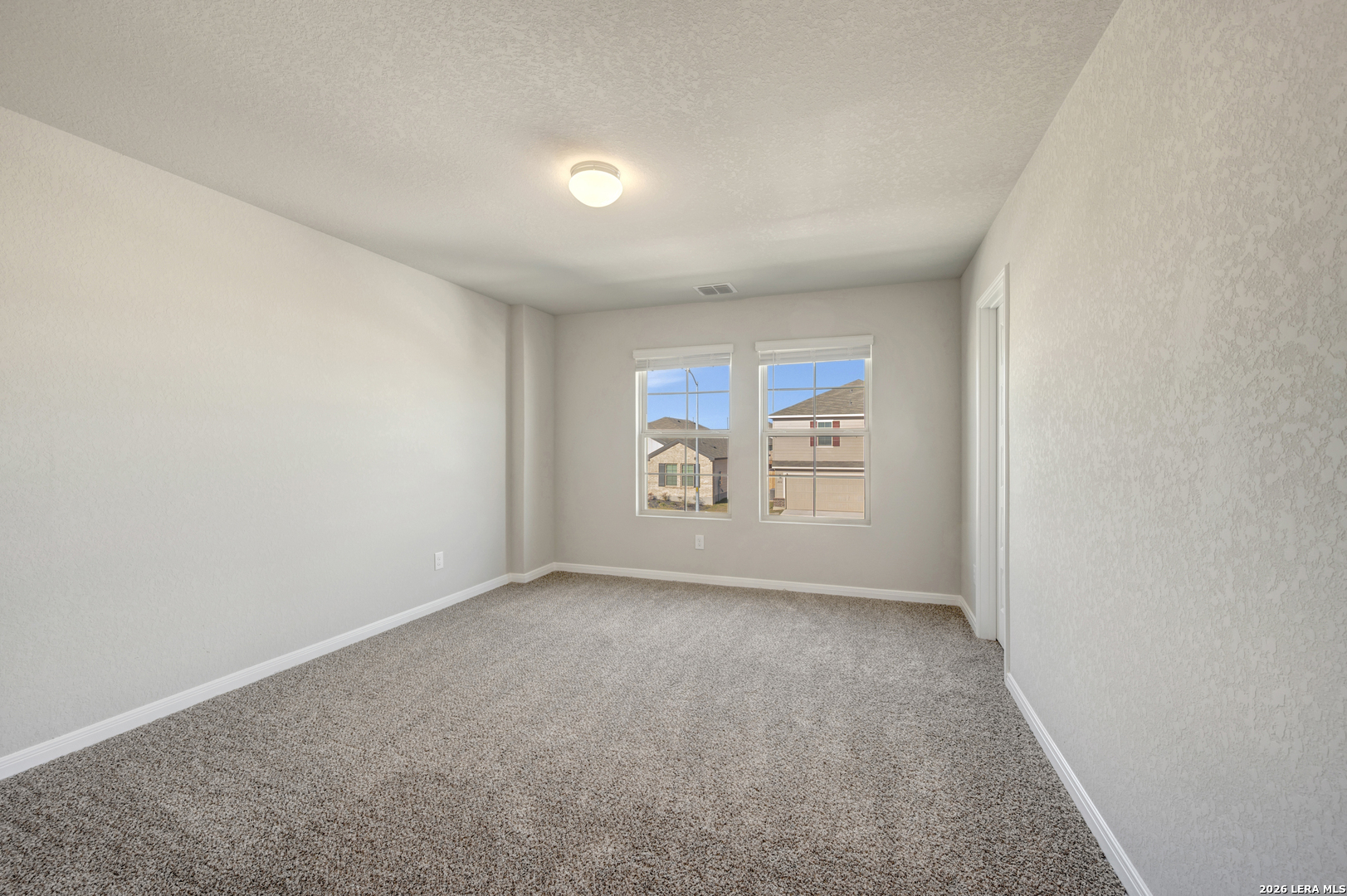 10330 Goodison Drive Converse, TX 78109 - Photo 33 of 42 an empty room with windows