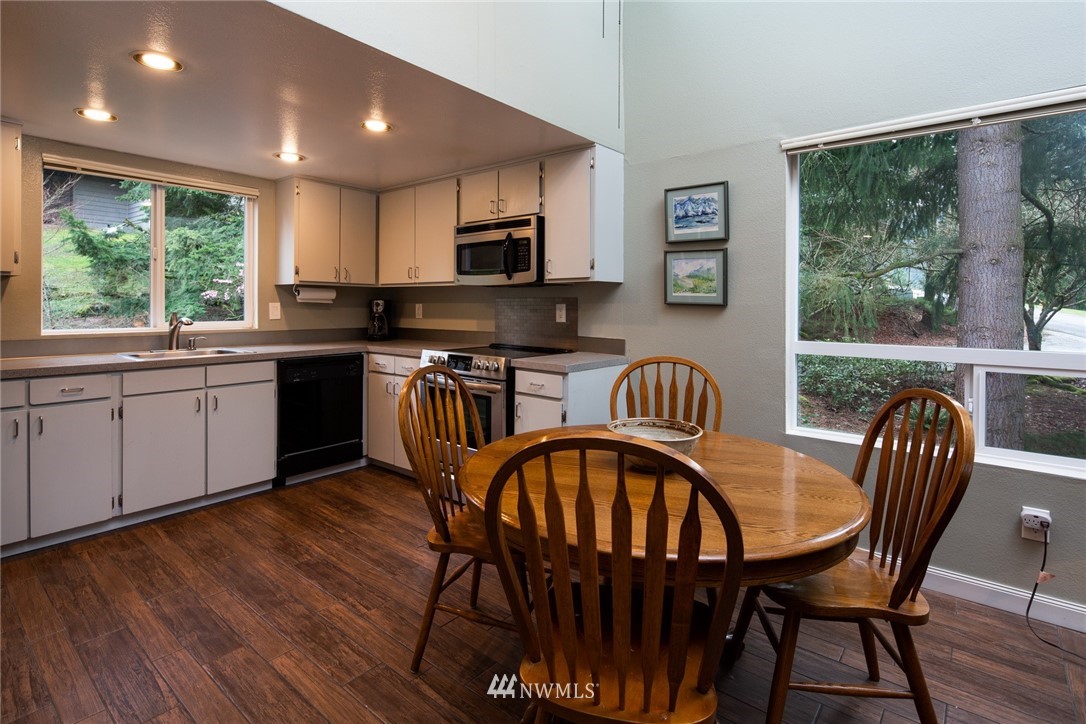 3 Barn View Drive, Unit 5 Bellingham, WA 98229 - Photo 11 of 25 a view of a dining room with furniture window and wooden floor