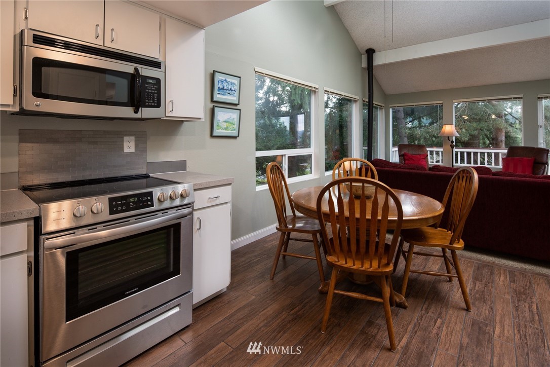 3 Barn View Drive, Unit 5 Bellingham, WA 98229 - Photo 13 of 25 a view of a dining room with furniture window and outside view