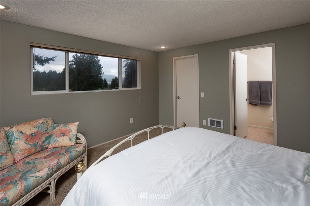 3 Barn View Drive, Unit 5 Bellingham, WA 98229 - Photo 17 of 25 a bedroom with a bed and a window