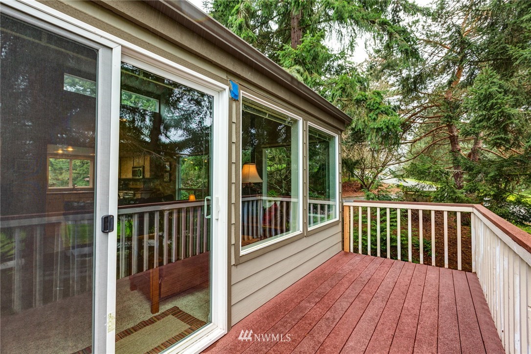 3 Barn View Drive, Unit 5 Bellingham, WA 98229 - Photo 5 of 25 a view of backyard with large trees and wooden floor