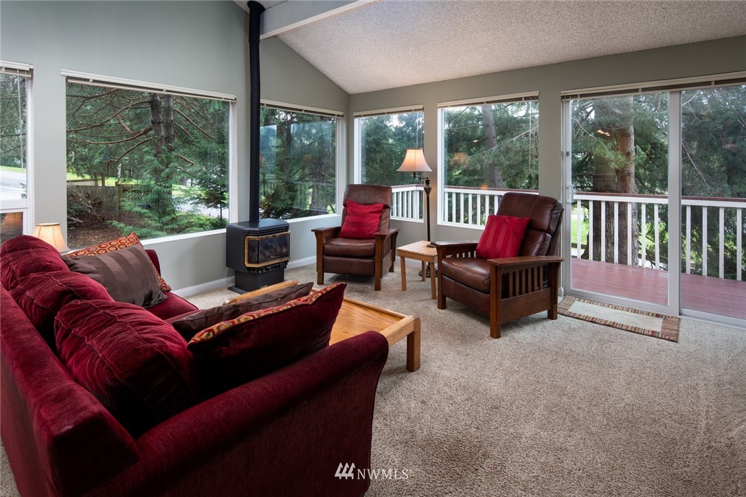 3 Barn View Drive, Unit 5 Bellingham, WA 98229 - Photo 7 of 25 a living room with furniture and a floor to ceiling window