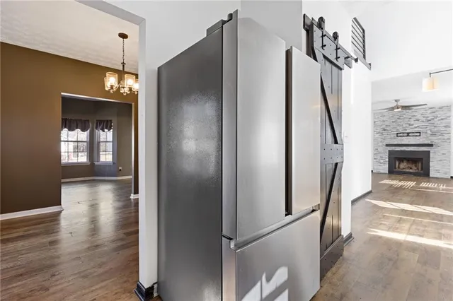 a view of a livingroom with wooden floor and stairs