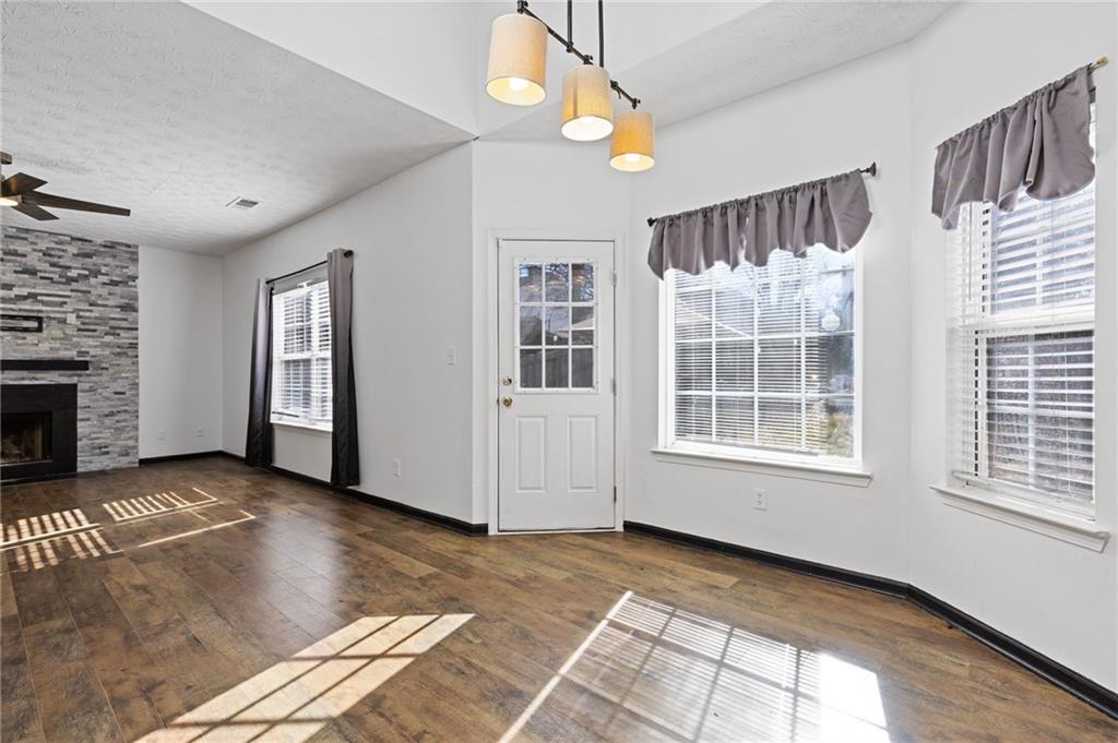 7035 Red Maple Lane Lithonia, GA 30058 - Photo 15 of 37 a view of an empty room with window and fireplace