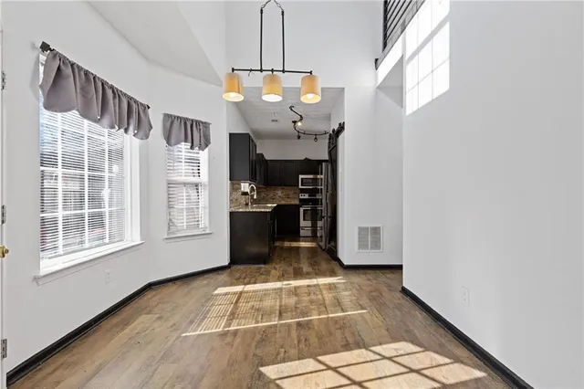 a view of an entryway with wooden floor