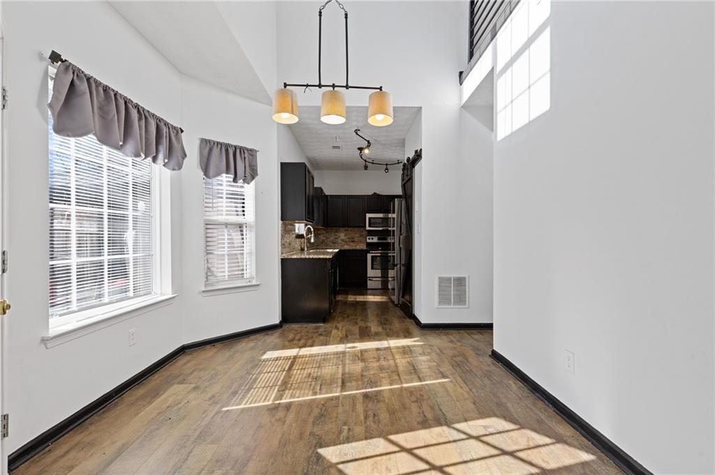 7035 Red Maple Lane Lithonia, GA 30058 - Photo 16 of 37 a view of an entryway with wooden floor