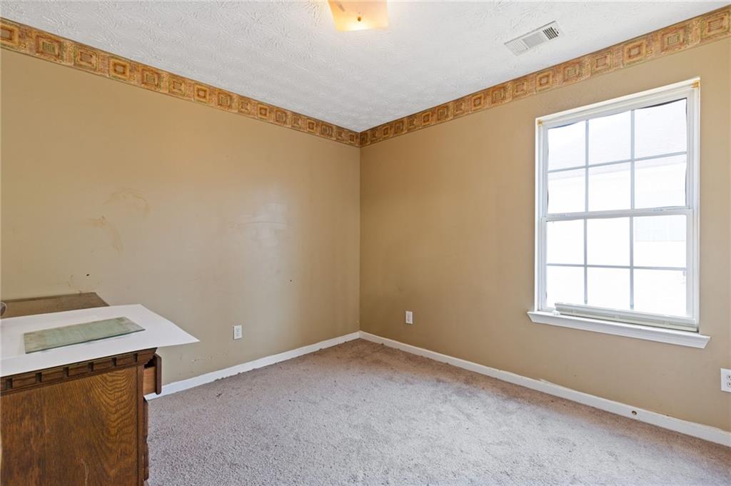 7035 Red Maple Lane Lithonia, GA 30058 - Photo 31 of 37 a view of an empty room with a window