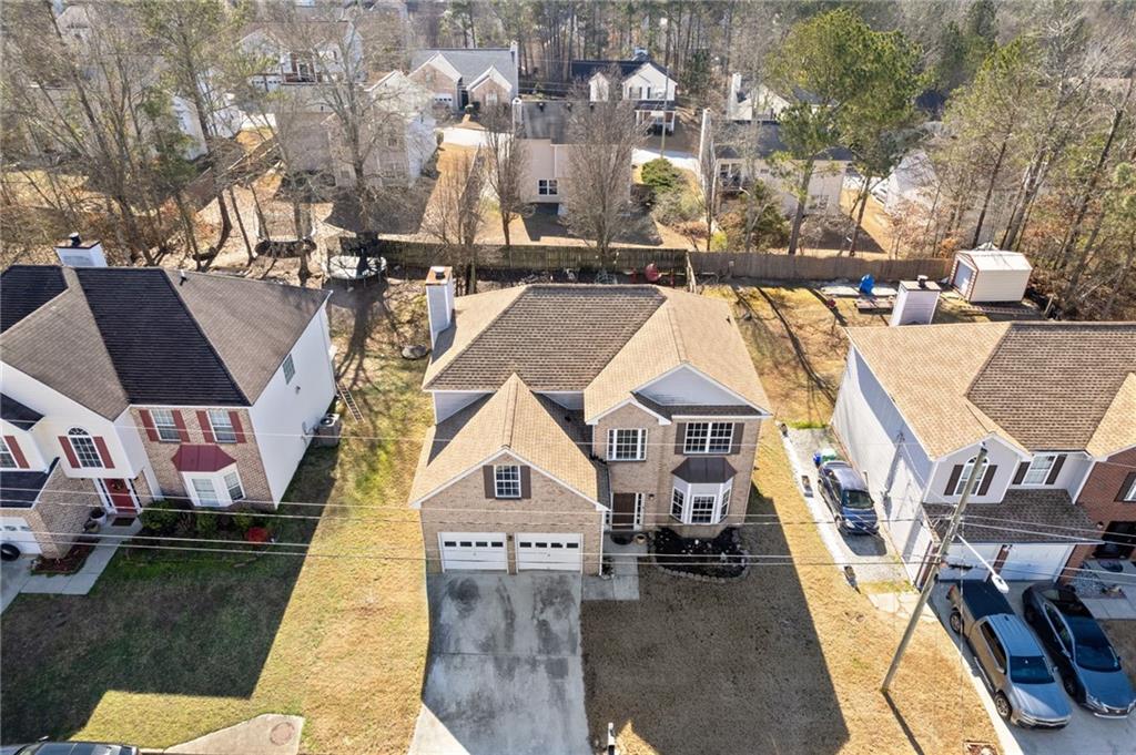 7035 Red Maple Lane Lithonia, GA 30058 - Photo 32 of 37 an aerial view of residential houses with outdoor space